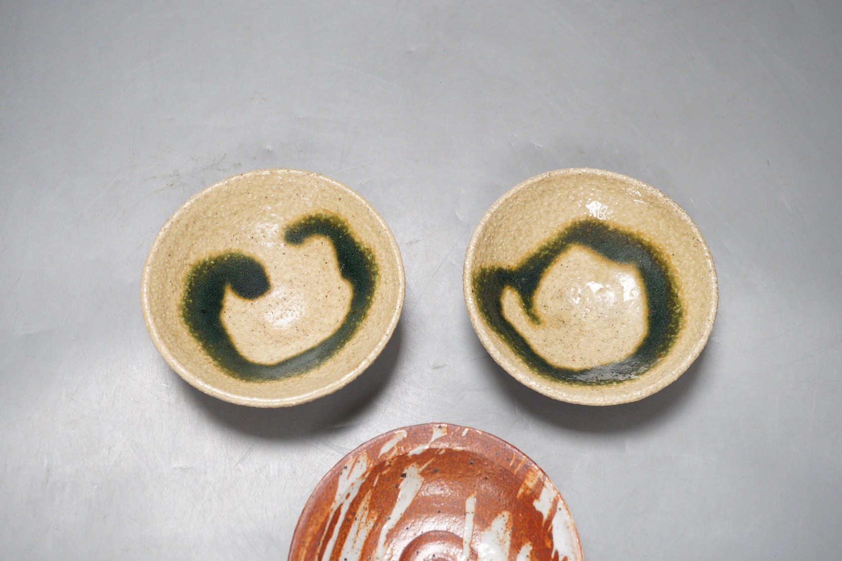 Aki Moriuchi (born 1947) three stoneware footed dishes, largest 11.5cm diameter